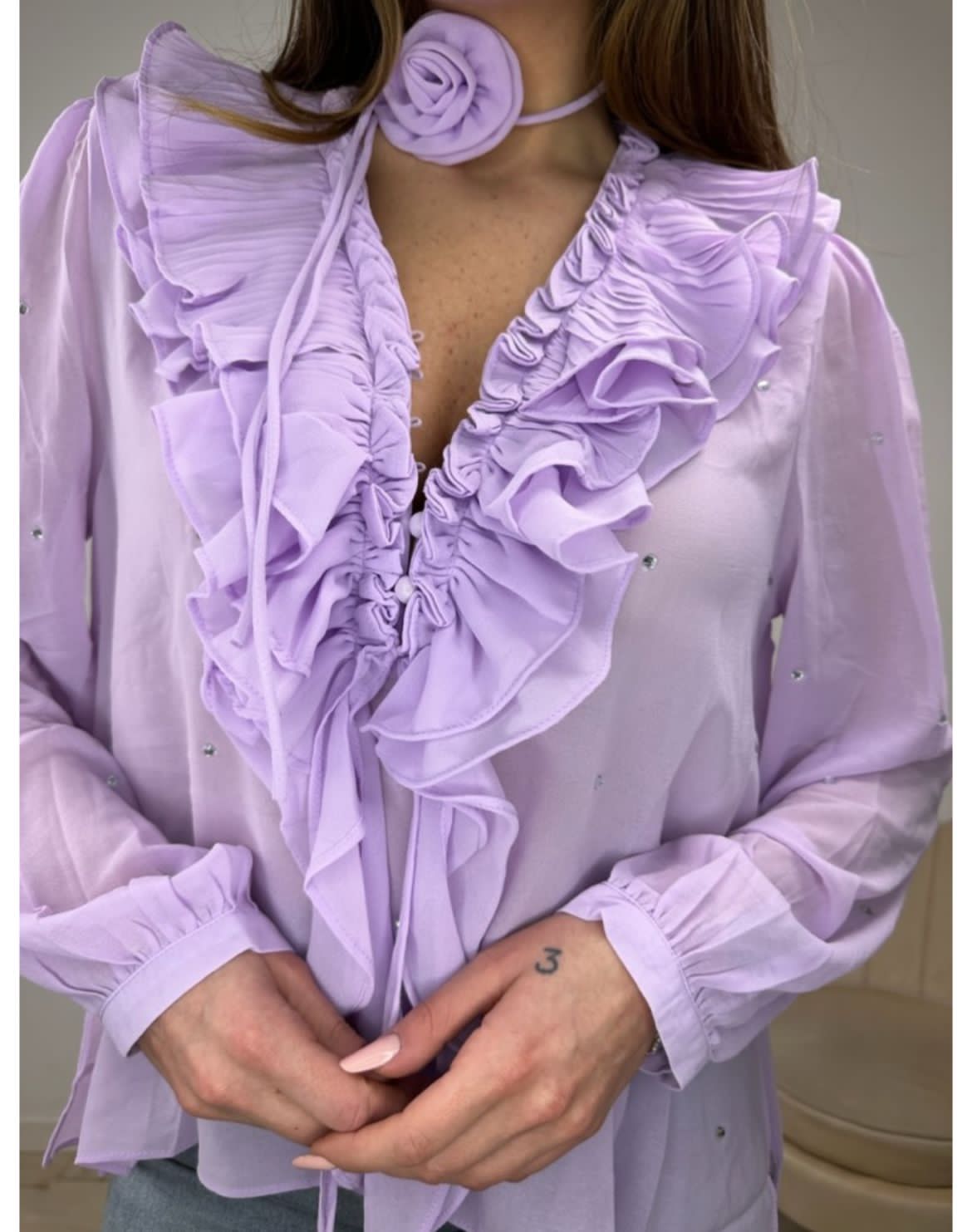 Violet ruffle top with rose detail