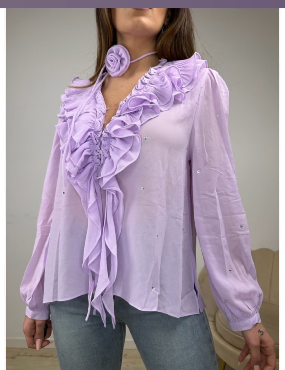 Violet ruffle top with rose detail